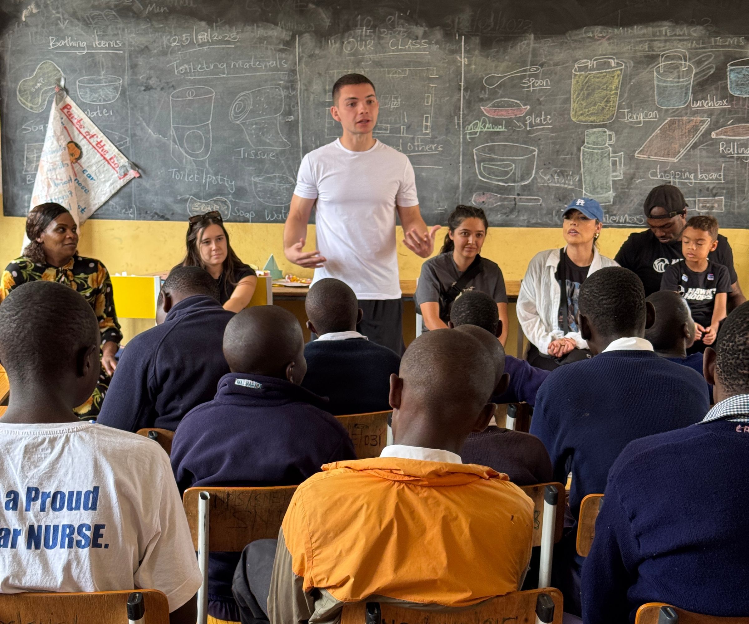 Man speaking to students in classroom setting