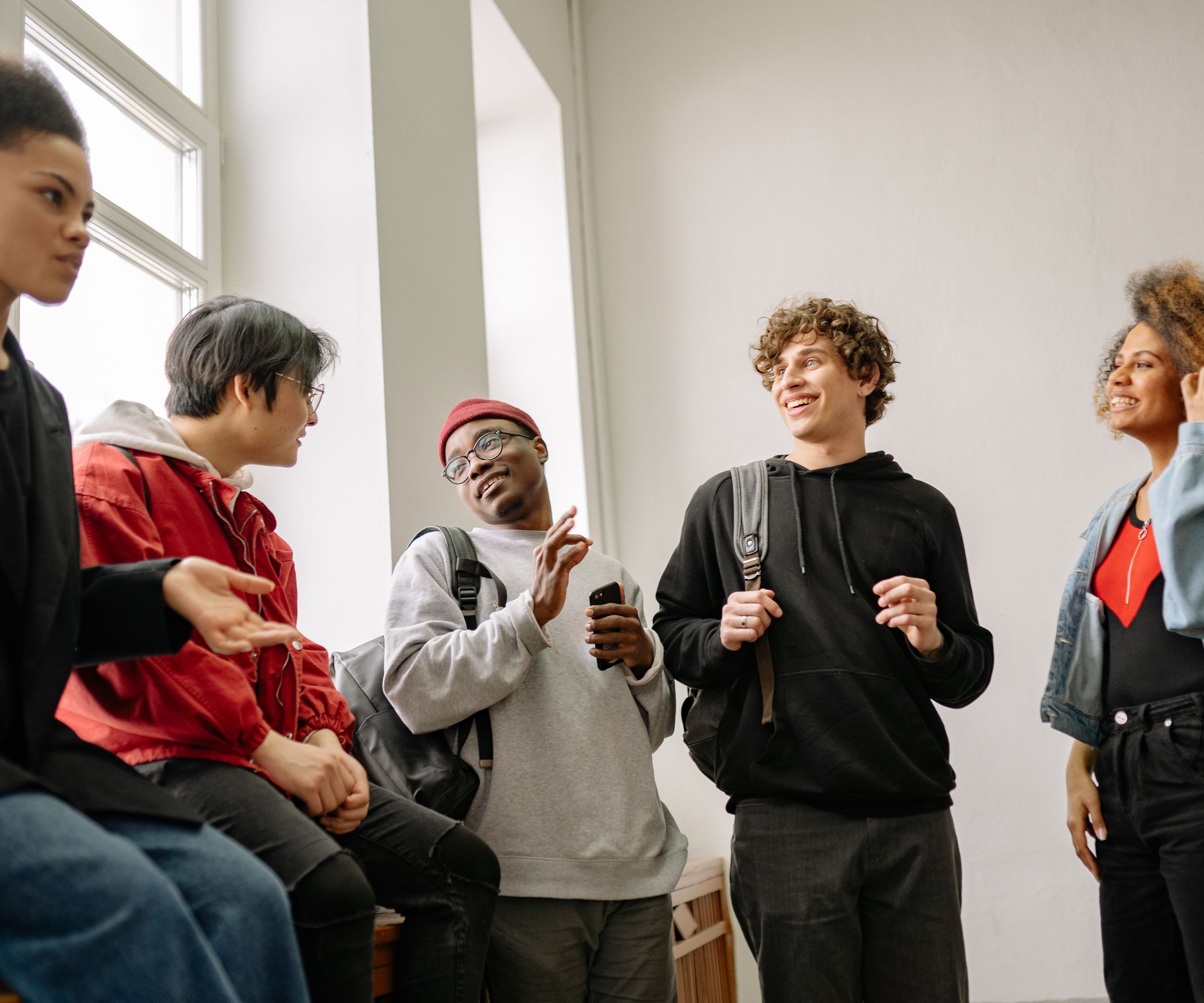 Diverse group of students chatting indoors